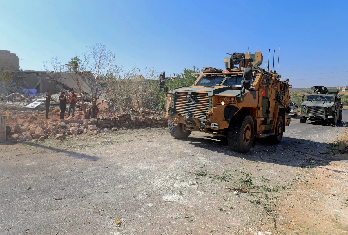 Turkish troops in armored personnel carriers arrive in the Jabal al-Zawiya region of Syria's rebel-held northwestern Idlib province on July 22, 2021. (AFP)