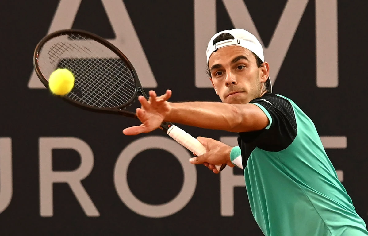 Argentinian Francisco Cerundolo returns a ball to Russian Andrei Rublev during the Hamburg tennis tournament in Hamburg, Germany, on Thursday. (DPA via AP)