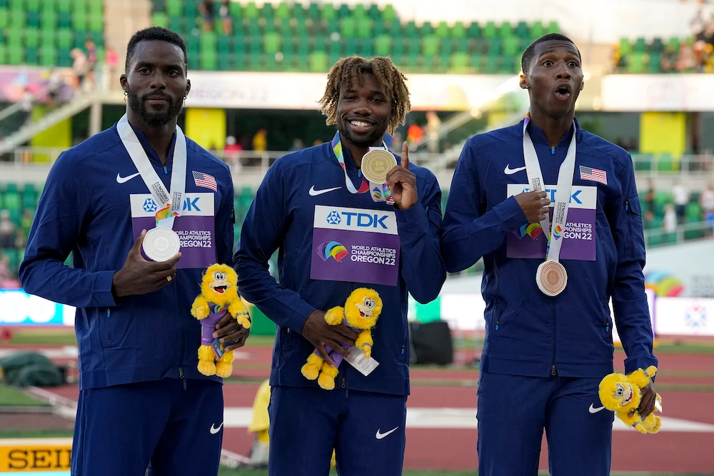 Gold medalist Noah Lyles, center, silver medalist Kenneth Bednarek, left, and bronze medalist Erriyon Knighton during a medal ceremony for the men’s 200-meter run final at the World Athletics Championships. (AP)