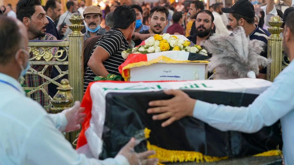 Mourners carry caskets of those who were killed during an attack in the city of Zakho, Duhok provinceof the Kurdish region in northern Iraq. (AFP)
