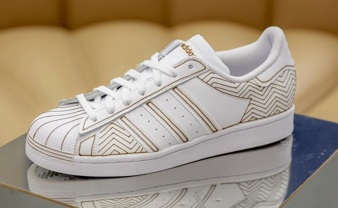The artist, who is also a chiropractor, decorated three pairs of crips white Adidas sneakers with detailed linework. (Instagram)
