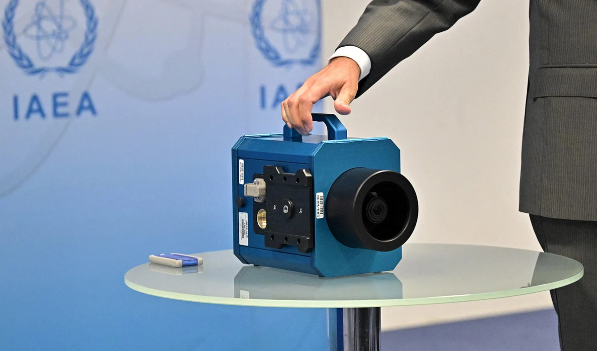 Rafael Grossi, Director General of the International Atomic Energy Agency (IAEA), informs journalists next to a camera about the current situation in Iran during a press conference in Vienna, Austria on June 09, 2022. (AFP/File)