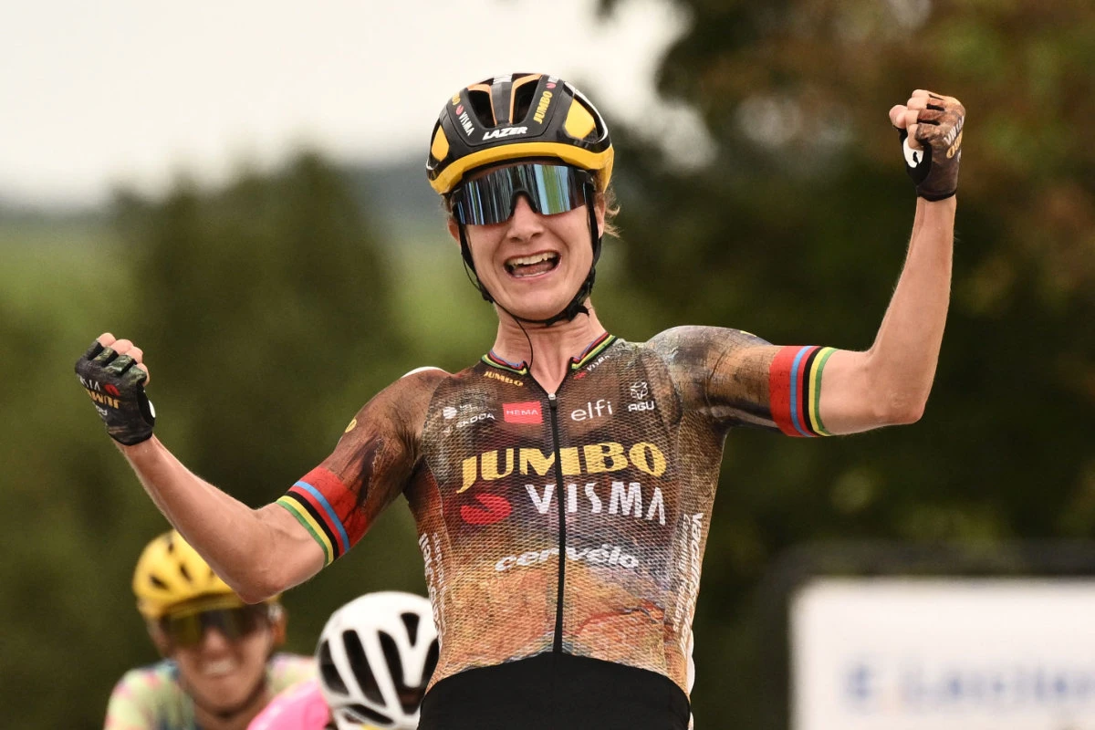 Team Jumbo Visma's Dutch rider Marianne Vos celebrates as she crosses the finish line to win the 2nd stage of the new edition of the Women's Tour de France cycling race on July 25, 2022. (AFP)