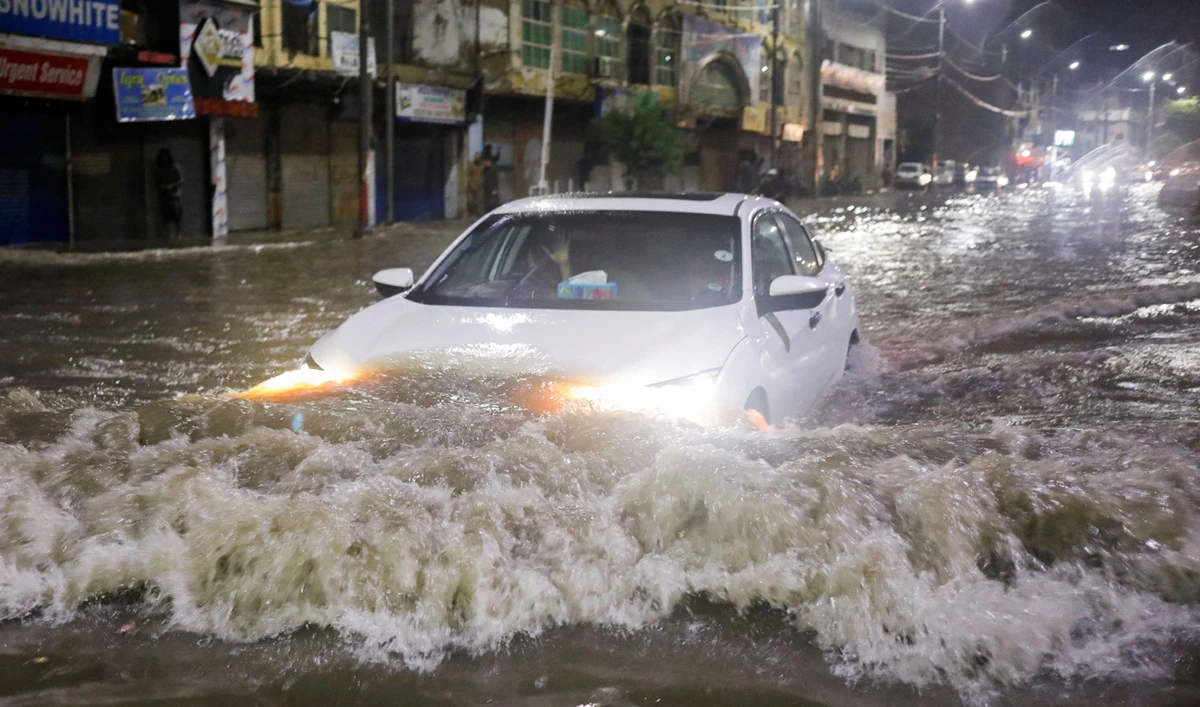 Pakistan's largest city battered by torrential rain as climate crisis makes weather more unpredictable