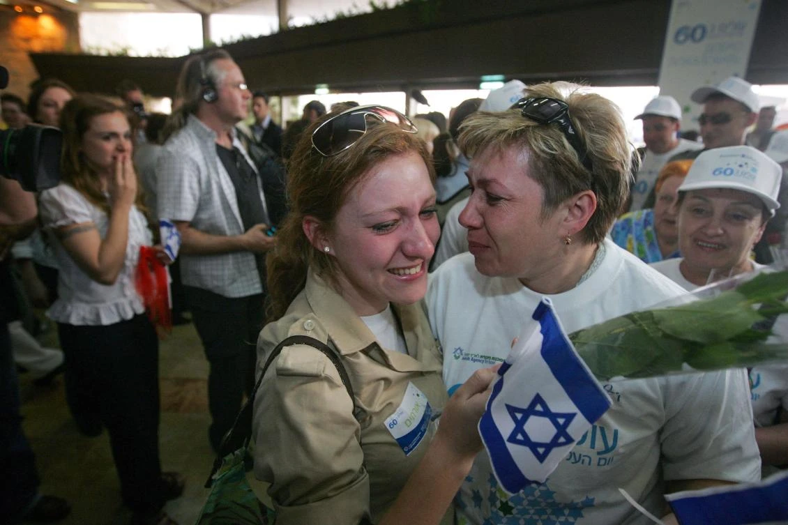 A Russian immigrant to Israel is embraced by well-wishers as she arrives at Israel’s Ben Gurion airport in this file photo taken on May 5, 2008. (AFP)