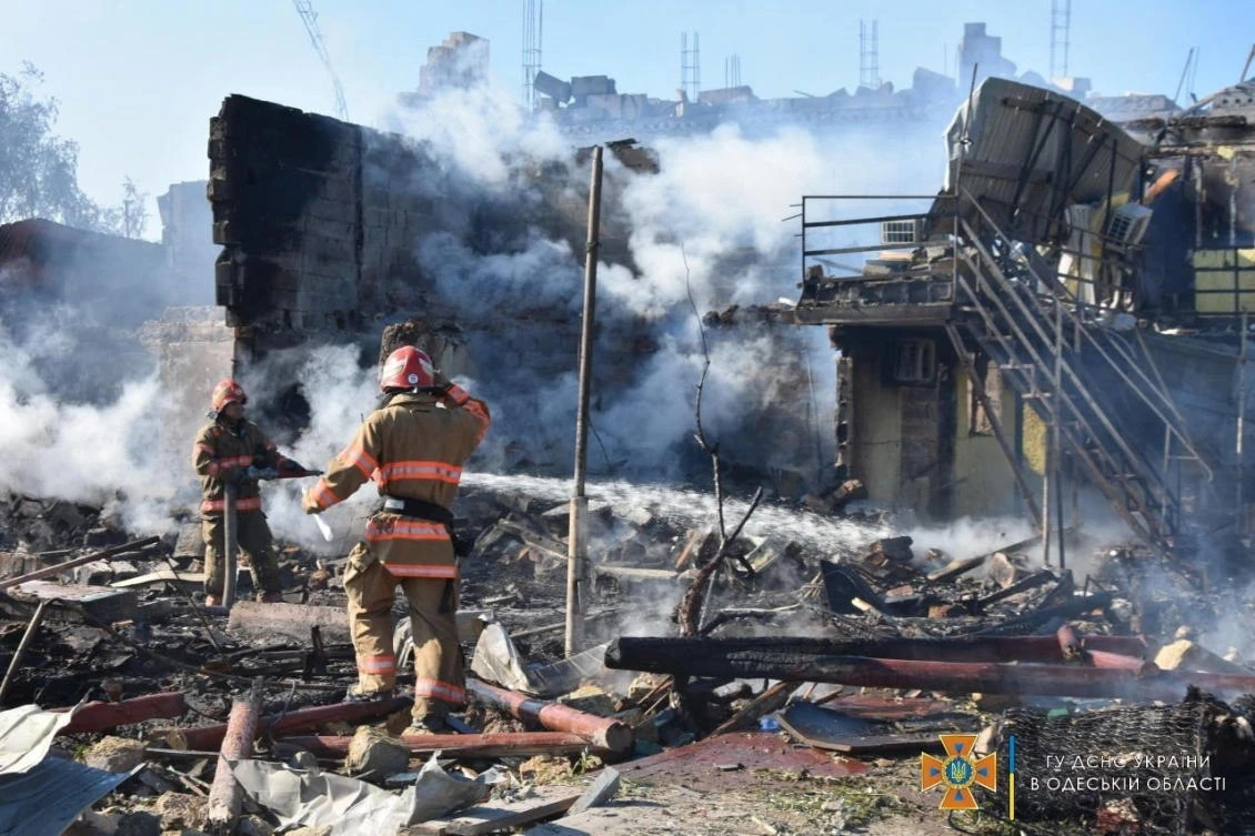 Firefighters work at site of a residential area damaged by a Russian missile strike in Zatoka, Odesa region, Ukraine on July 26, 2022. (State Emergency Service of Ukraine via Reuters)