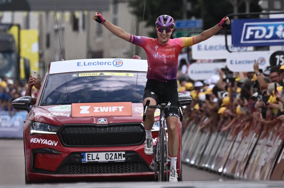 Team SD Worx's Swiss rider Marlen Reusser celebrates as she crosses the finish line to win the 4th stage of the new edition of the Women's Tour de France cycling race, 126,8 km between Troyes and Bar-sur-Aube, eastern France, on July 27, 2022. (AFP)