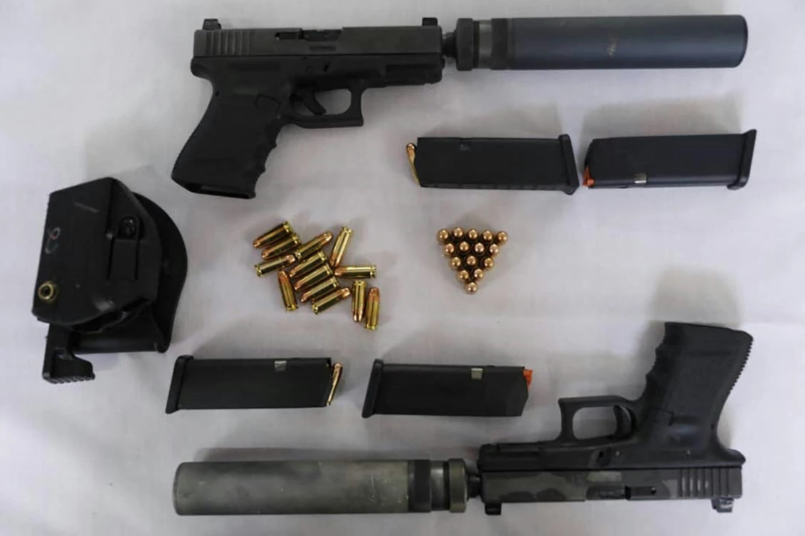 Weapons that Iran claims to have seized from agents linked to Israel's Mossad. (AFP)
