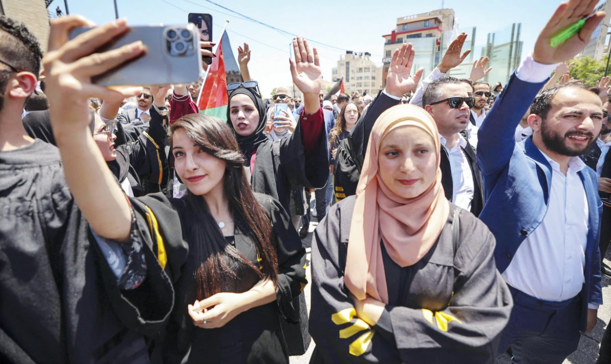 Lawyers demonstrate in front of the prime minister’s office in the city of Ramallah to reportedly protest the Palestinian president establishing laws by decree which they consider a violation of the independence of the judiciary. (File/AFP)