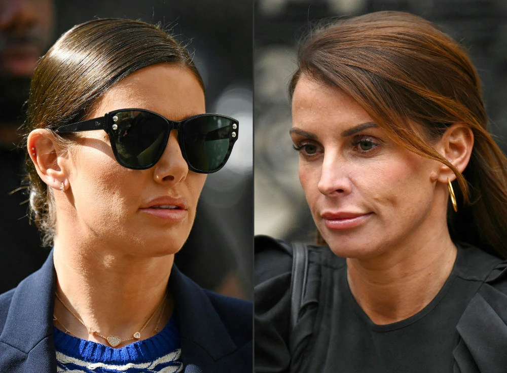 Rebekah Vardy (L), wife of England and Leicester City footballer Jamie Vardy, and Coleen Rooney, wife of former England footballer Wayne Rooney, outside the High Court in central London during the "Wagatha Christie" libel trial on May 12, 2022. (AFP)