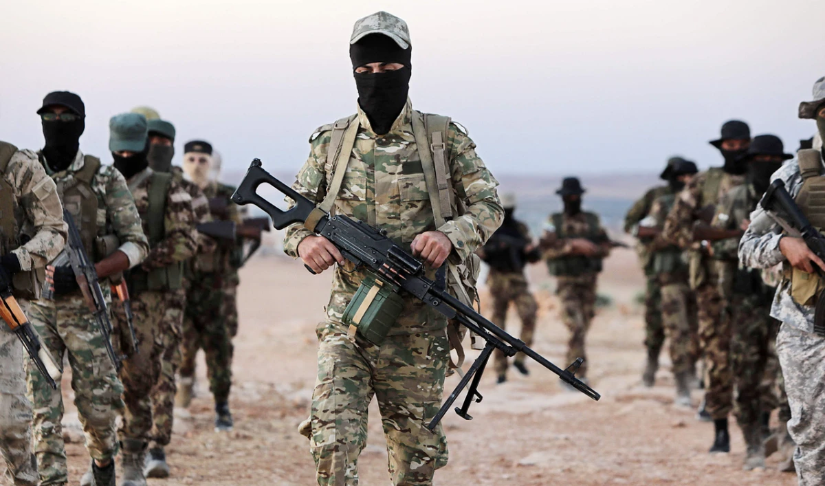 Turkey-backed Syrian fighters man a position outside the town of Kuljibrin, in the country’s northern Aleppo governorate. (AFP)