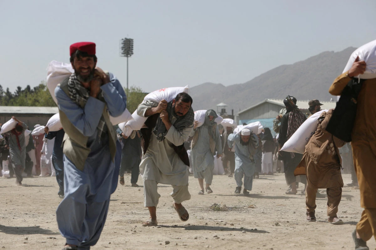 Kabul resident on at a distribution centre in Kabul, Afghanistan, April 7, 2022. (REUTERS)
