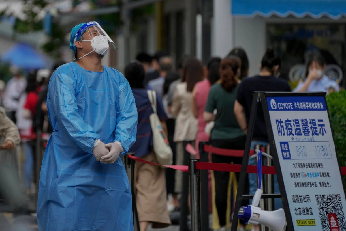 Residents line up at a COVID-19 testing center in Beijing on July 4, 2022. (AP)