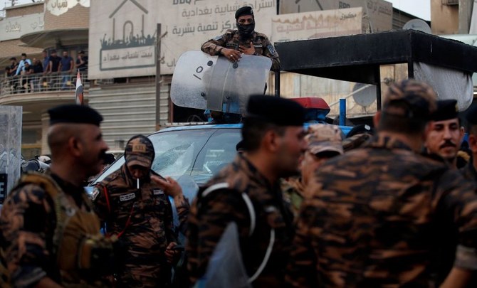 Iraqi riot police guard the Turkish visa office in Baghdad following the shelling of Zakho, Dohuk, July 21, 2022. (AFP)