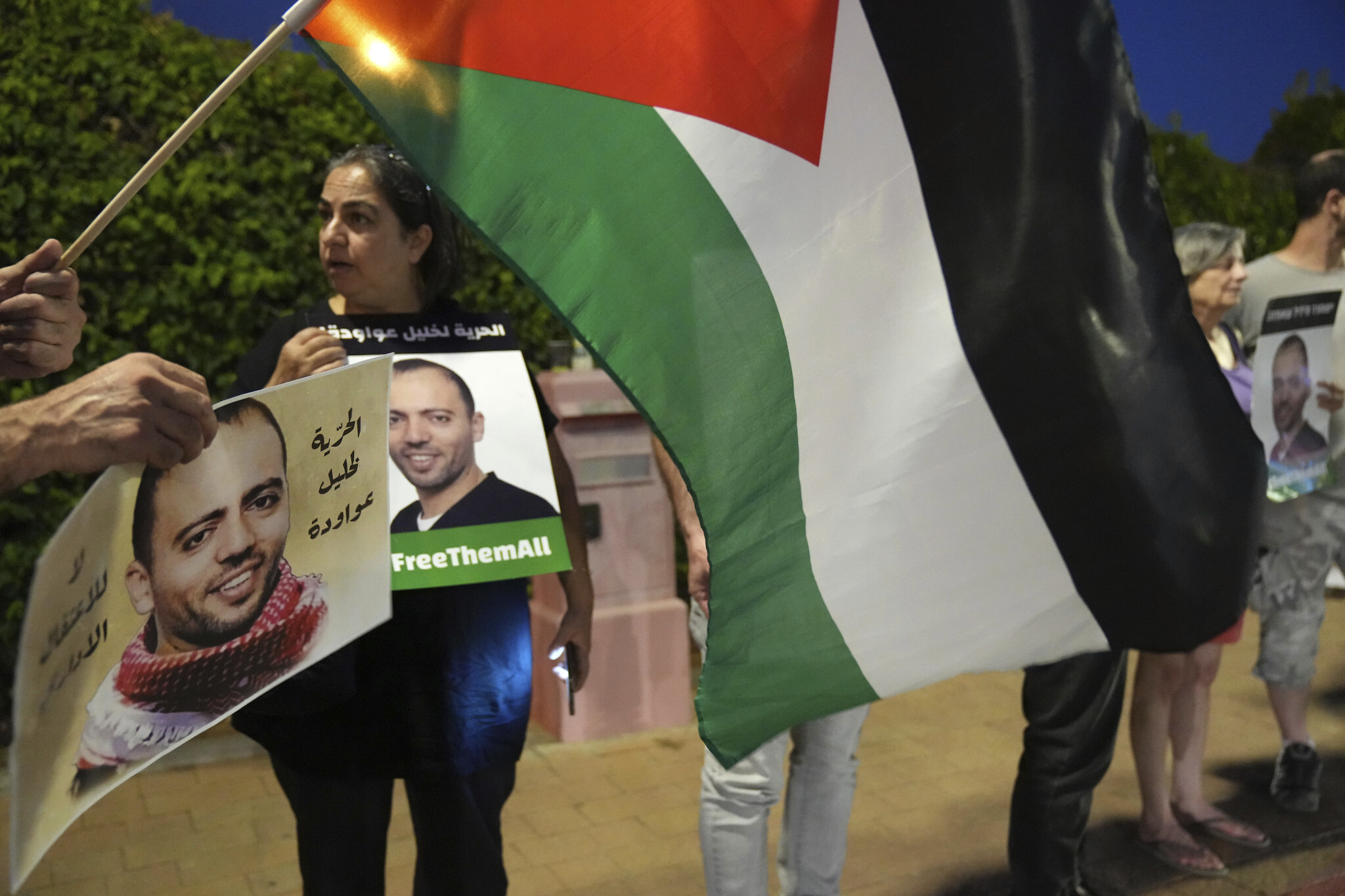 Protesters outside a hospital in Be’er Yaakov, where Khalil Awawdeh is being held in declining health, Aug. 13, 2022. (AP Photo)