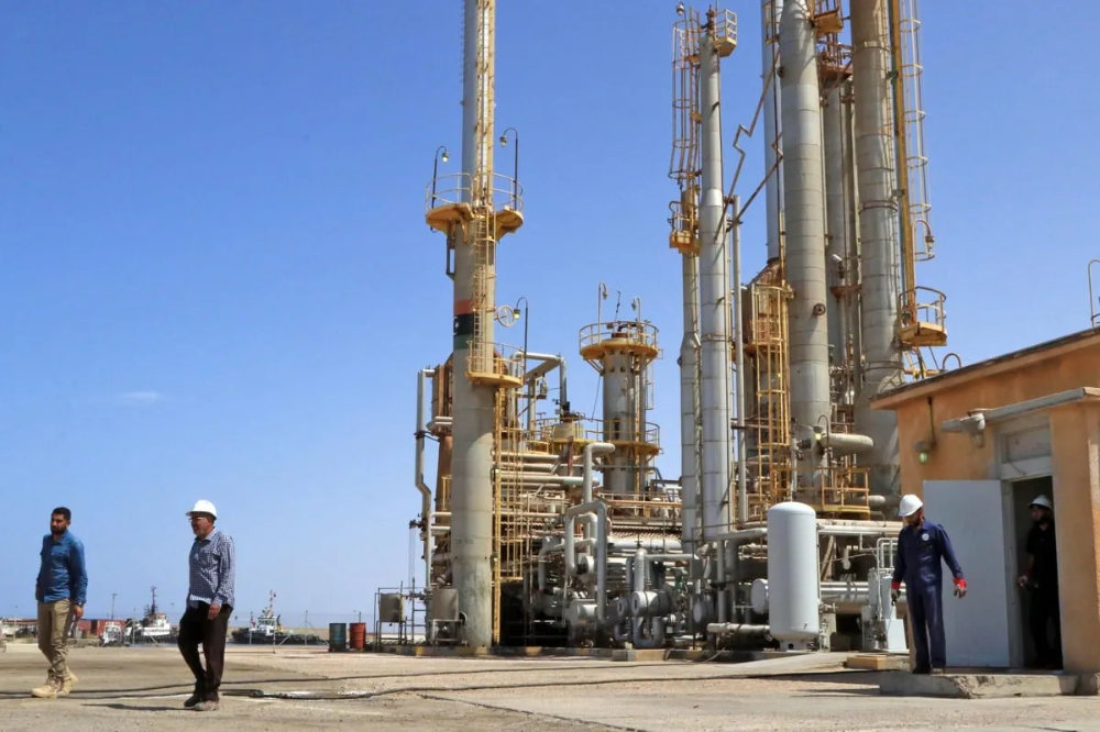 Workers at an oil port in Libya. (AFP/File)