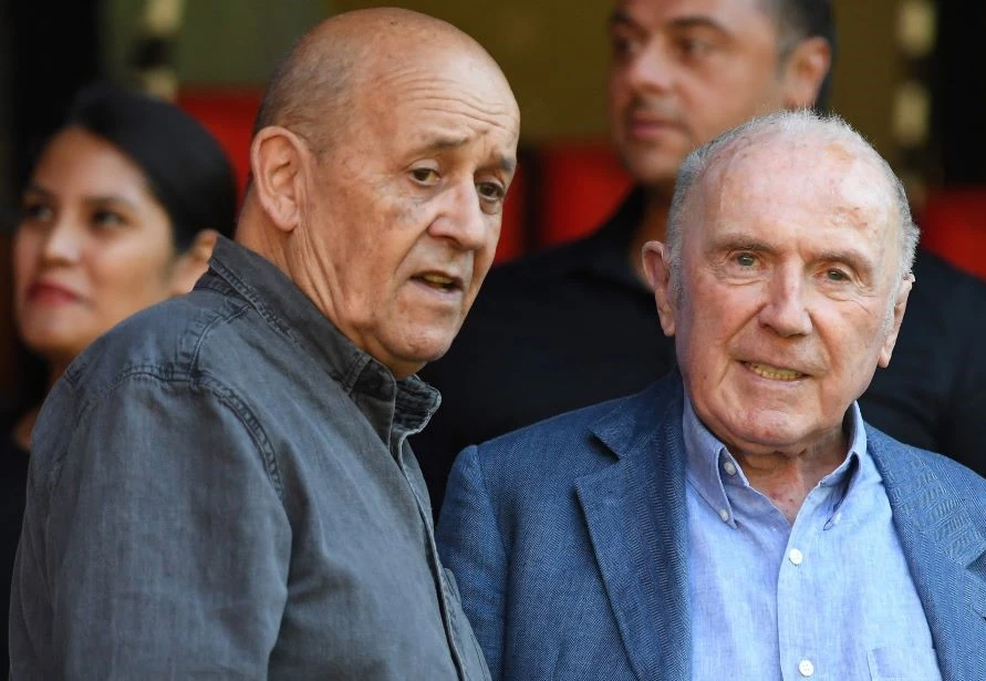 Former French FM Jean-Yves Le Drian, left, at a football match in Rennes, western France, Aug. 7, 2022. (AFP)