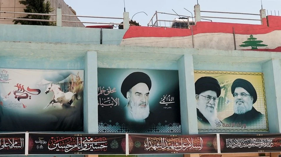 Images of Ruhollah Khomeini, Ali Khamenei and Hassan Nasrallah, Yaroun, Lebanon, Aug. 15, 2022. (Reuters)