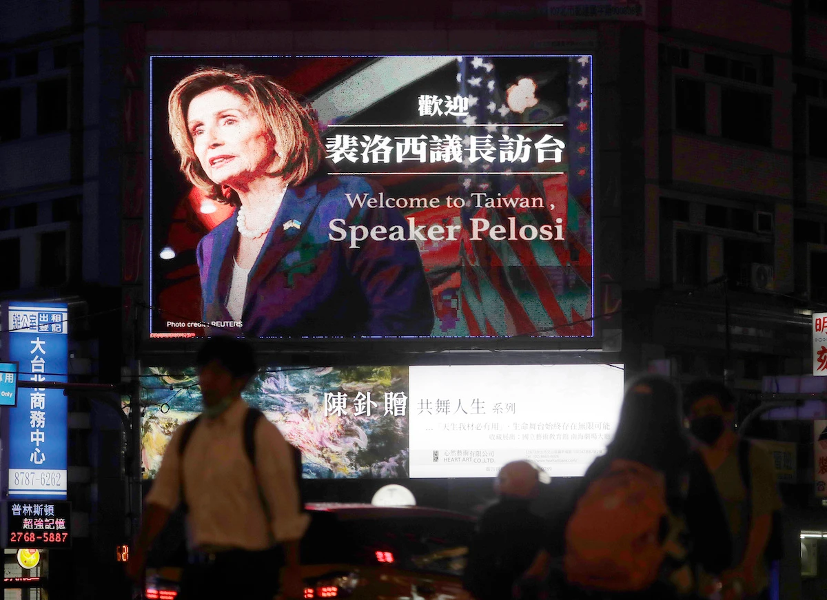 People walk past a billboard welcoming US House Speaker Nancy Pelosi, in Taipei, Taiwan, Tuesday, Aug 2, 2022. (AP)
