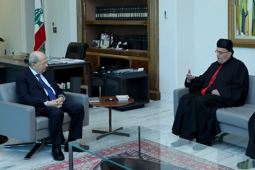 Lebanese president Michel Aoun meets with Maronite archbishop Moussa el-Hajj at the presidential palace on July 22, 2022. (Dalati Nohra via AP)