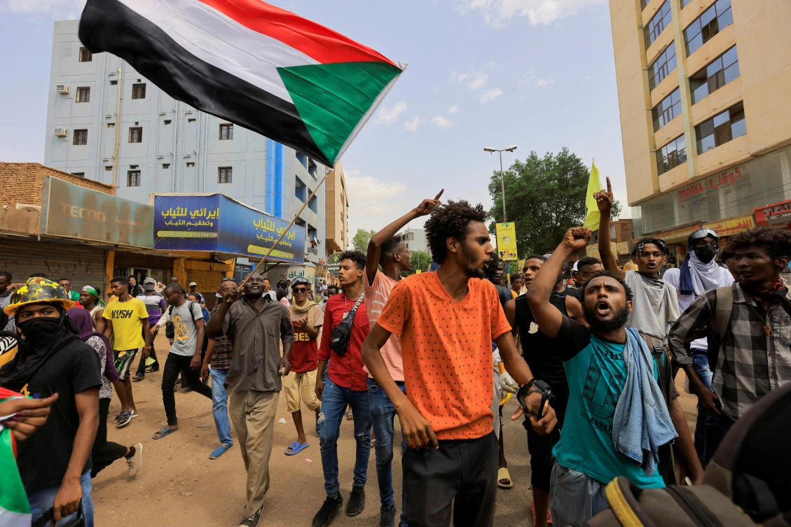 Protesters march during a rally against military rule following the last coup, in Khartoum, Sudan on Sunday. (Reuters)