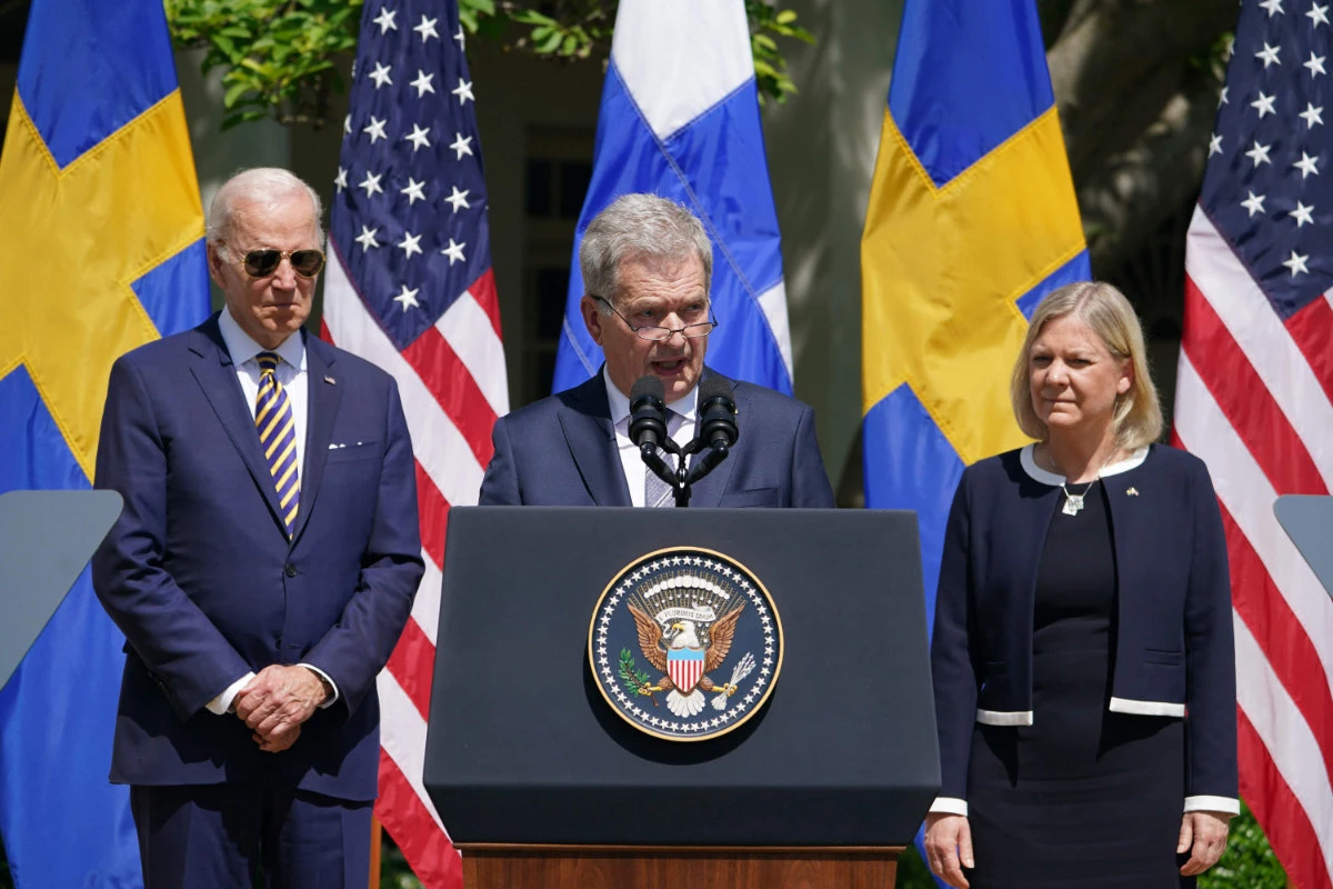 In this May 19, 2022, photo, Finland’s President Sauli Niinistö speaks about his country's' bid to join NATO while US President Joe Biden (L) and Sweden’s PM Magdalena Andersson (R) listen. (AFP)