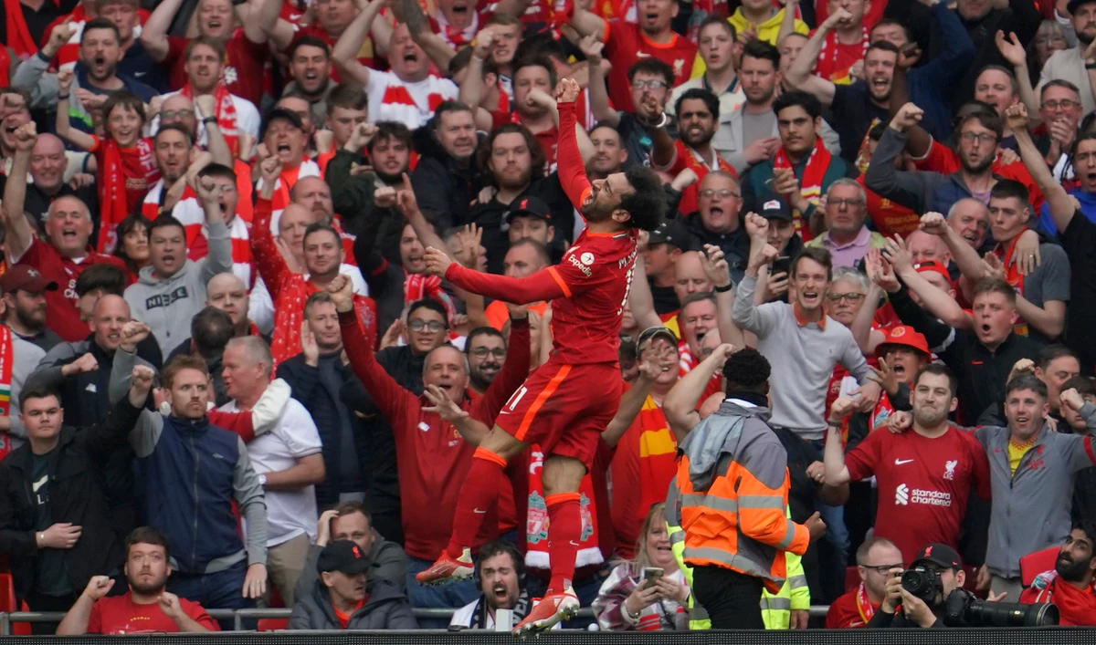 Liverpool's Mohamed Salah celebrates after scoring his goal during the Premier League match against Wolverhampton on May 22, 2022. NBC celebrates a milestone this weekend when it begins its 10th season of covering the Premier League. (AP/File)