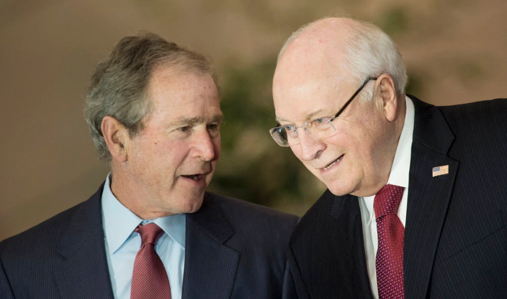 Former US President George W. Bush (L) and Vice President Dick Cheney talk on December 3, 2015, during a dedication ceremony hosted by the US Senate at Emancipation Hall of the US Capitol Visitor Center in Washington, DC. (AFP)