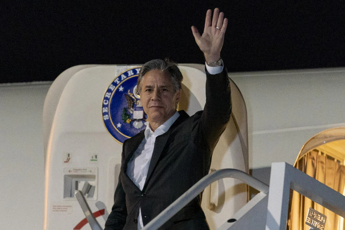 US Secretary of State Antony Blinken waves as he arrives at Lanseria International Airport in Johannesburg, South Africa, Sunday, Aug. 7, 2022. (AP)