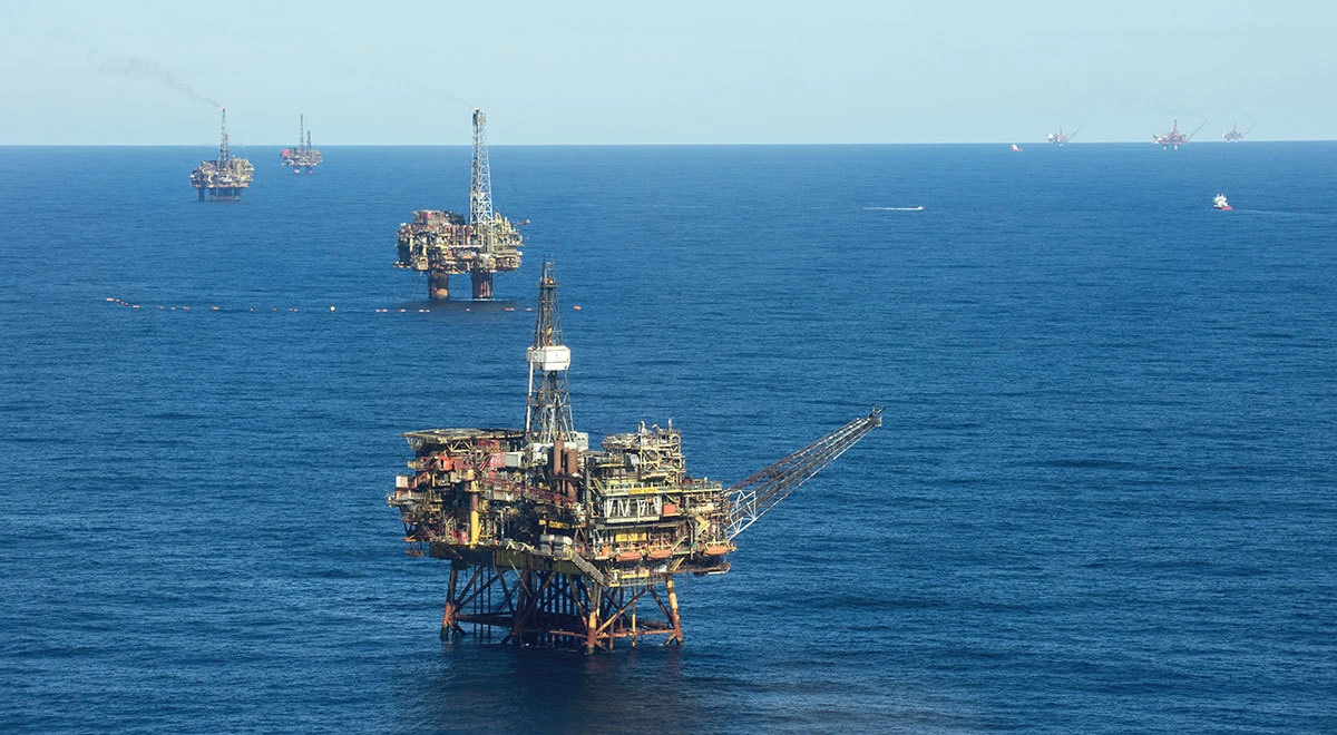 Oil prices hovered near multi-month lows on Monday, pressured by lingering worries about an economic slowdown.