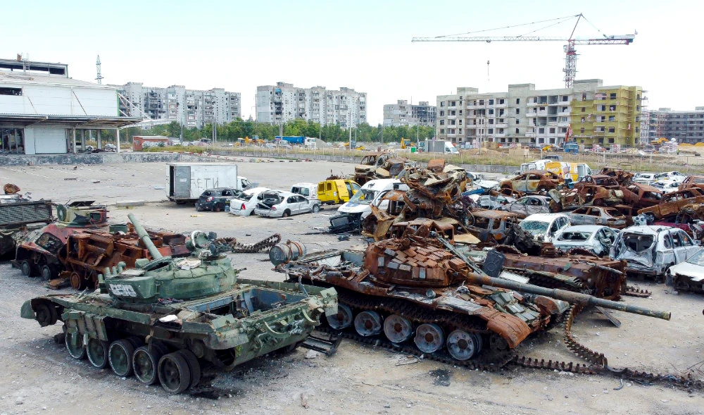 Destroyed tanks and civilian vehicles that were caught in heavy fighting are gathered in a lot in Mariupol, Mariupol, on the territory which is under the Government of the Donetsk People's Republic control, eastern Ukraine, Sunday, Aug. 7, 2022. (AP)