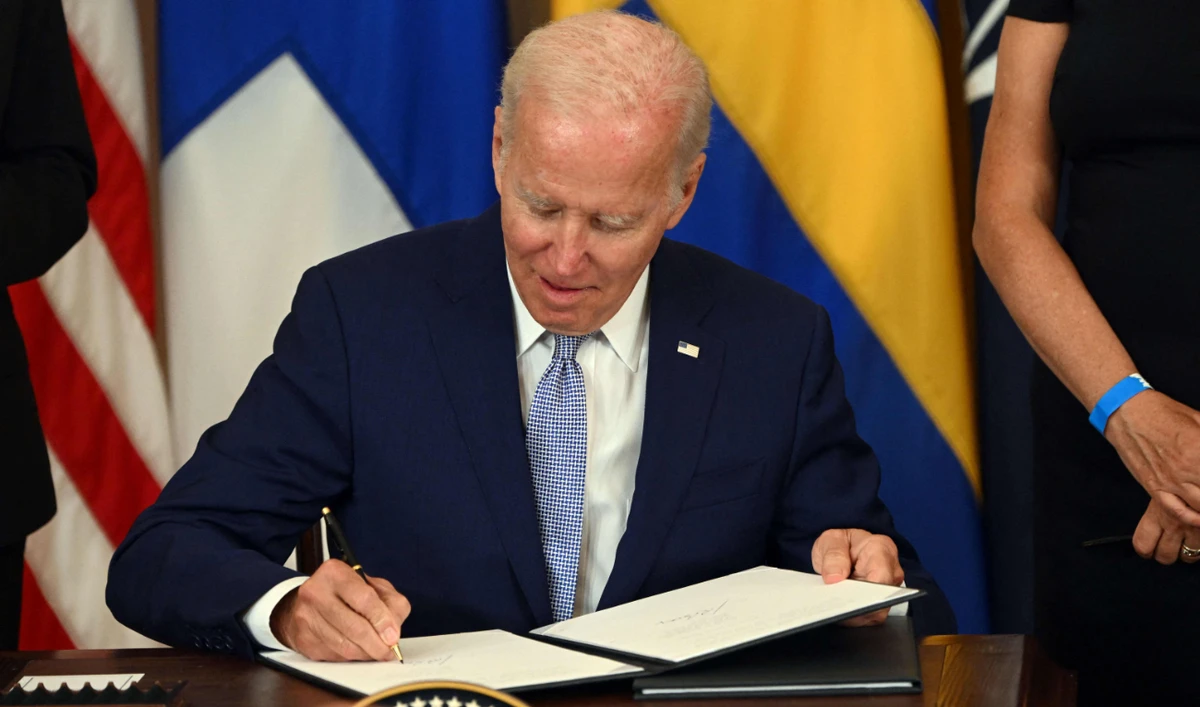 US President Joe Biden signs the Instruments of Ratification for the Accession Protocols to the North Atlantic Treaty for Finland and Sweden, in Washington, DC, on August 9, 2022. (AFP)