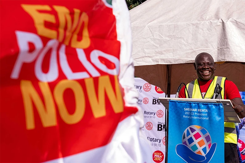 Kunle Adeyanju speaks at the Ikeja Rotary club in Lagos on May 29, 2022, after arriving from a 41-day trip from London, by motorbike, to raise funds and awareness for the End Polio campaign. (AFP)