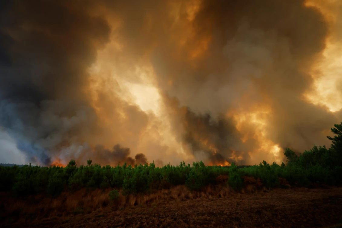 General view of smoke and flames from the fire in Belin-Beliet, as wildfires continue to spread in the Gironde region of southwestern France, on Wednesday. (Reuters)