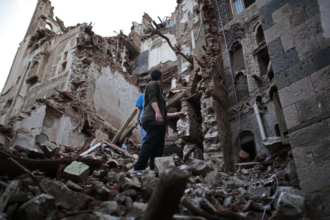 People inspect a UNESCO-listed building which collapsed due to heavy rain in the old city of Sanaa, Yemen. (AP)