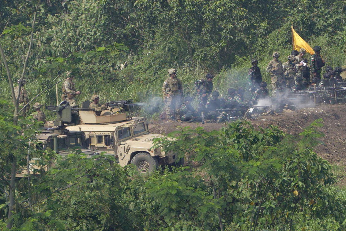 US and Indonesian soldiers provide fire support during the joint military exercises in South Sumatra, Indonesia on Aug. 12, 2022. (AP)