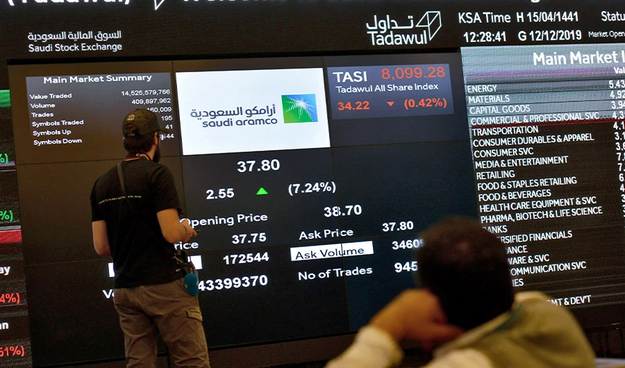 This picture taken December 12, 2019 shows a view of the exchange board at the Stock Exchange Market (Tadawul) bourse in Riyadh displaying Aramco shares on the second day of their trading. (AFP/FILE)