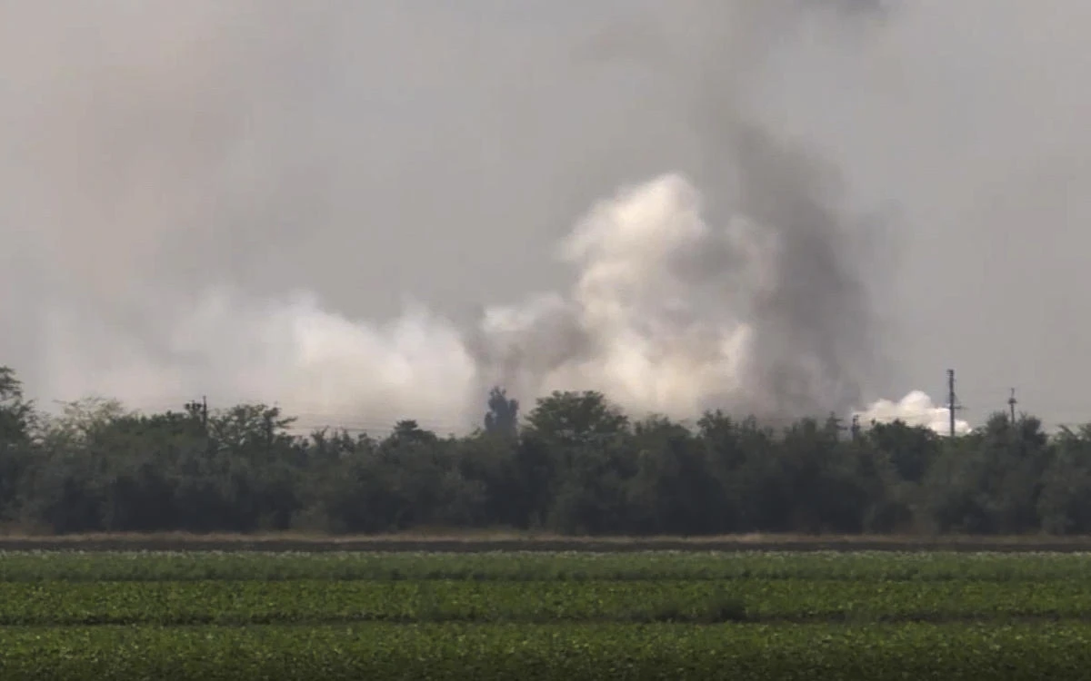 In this image taken from video provided by the RU-RTR Russian television on Tuesday, smoke rises over the site of explosion at an ammunition storage of Russian army near the village of Mayskoye, Crimea. (AP)