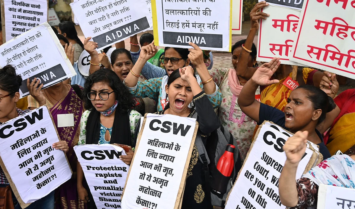 Activists shout slogans and hold placards during a protest against the release of men convicted of gang-raping Bilkis Bano during the 2002 communal riots in Gujarat, in New Delhi on August 18, 2022. (AFP)