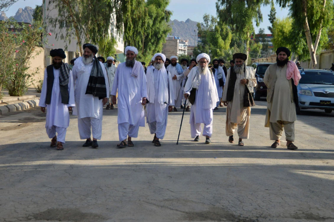 Taliban religious scholars leave after attending a public meeting on economic welfare at a private salon in Kandahar, Afghanistan, on August 18, 2022. (AFP)