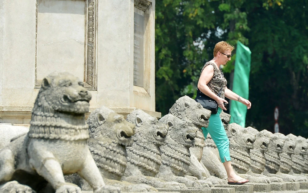 A tourist walks through Sri Lanka's Independence Memorial Hall in Colombo. (AFP file photo)
