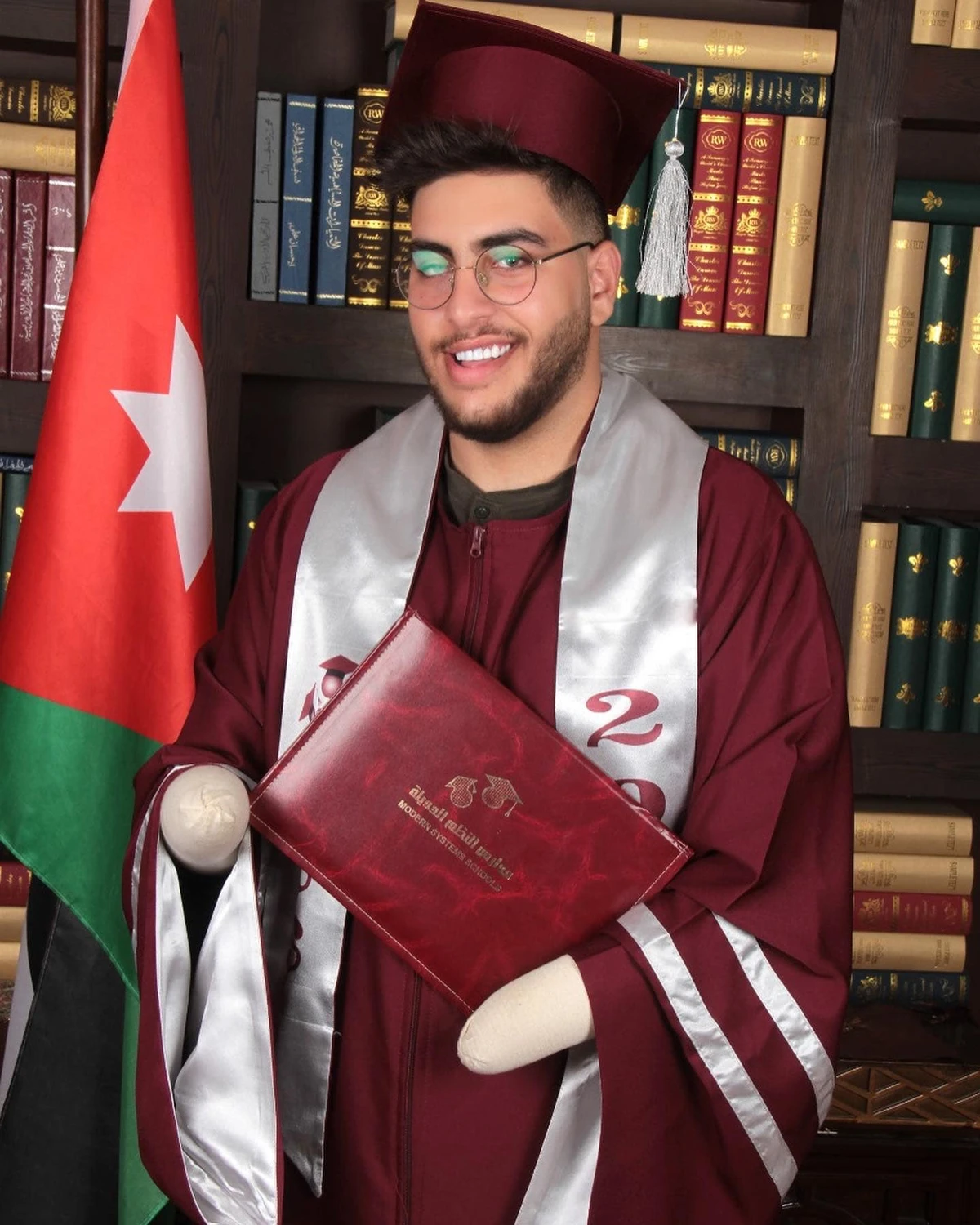 Horrifically injured Jordanian boy graduates from high school