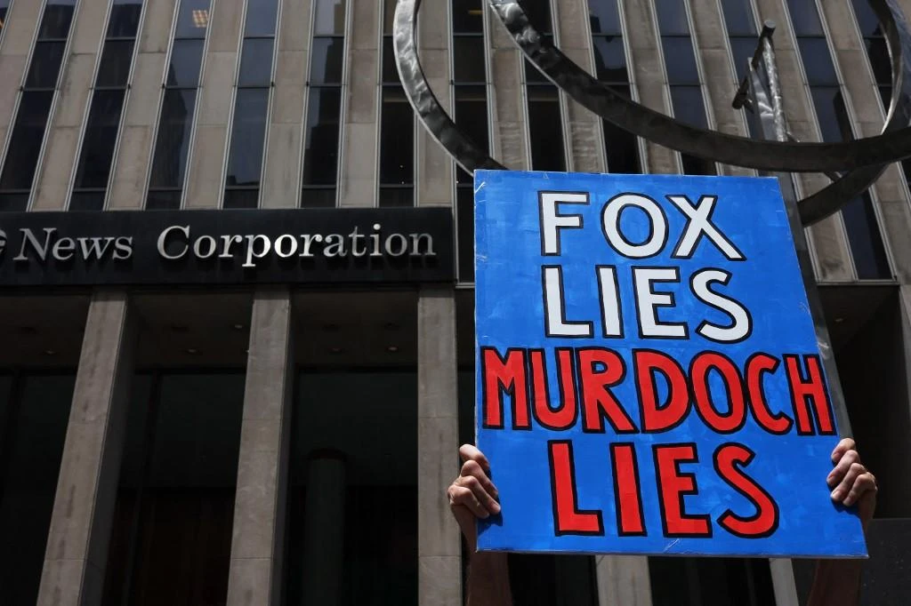 Above, protesters outside the Fox News headquarters in New York City on on June 14, 2022. (Getty Images via AFP)