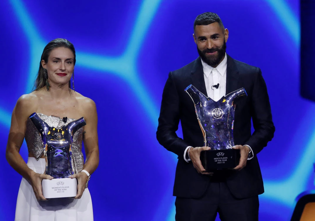 Real Madrid’s Karim Benzema poses with the men’s player of the year award and the women’s player of the year award winner FC Barcelona’s Alexia Putellas at Halic Congress Center, Istanbul on Thursday. (Reuters)