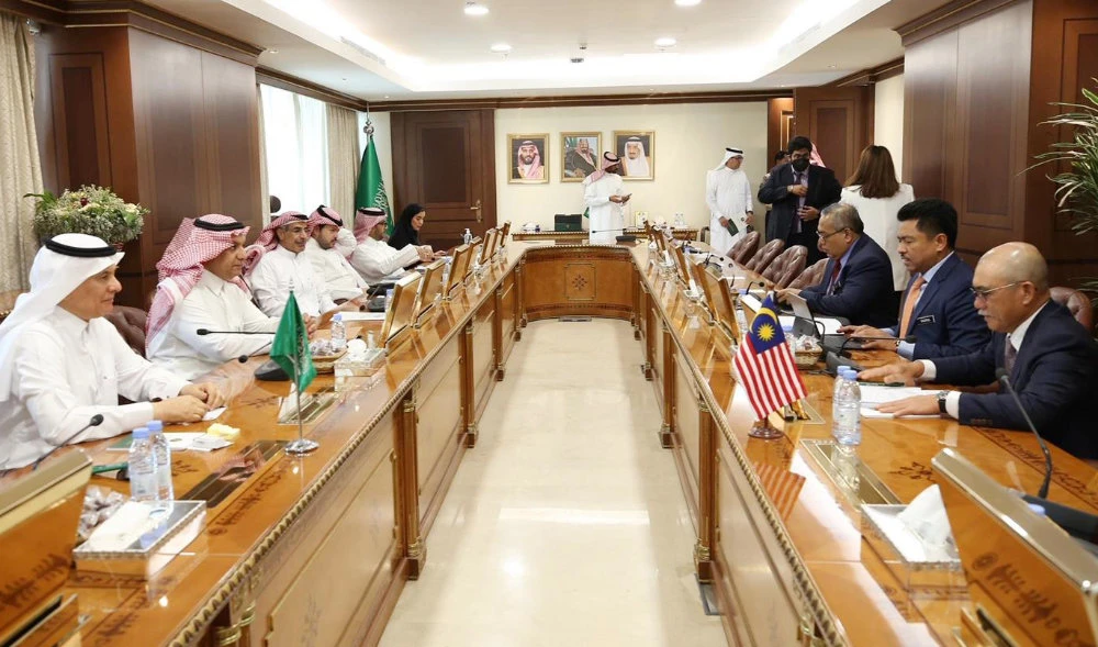 Saudi minister Abdul Rahman Al-Fadli meets with Malaysian Minister of Agriculture and Food Industries Ronald Kiandee in Riyadh on Friday. (Supplied)