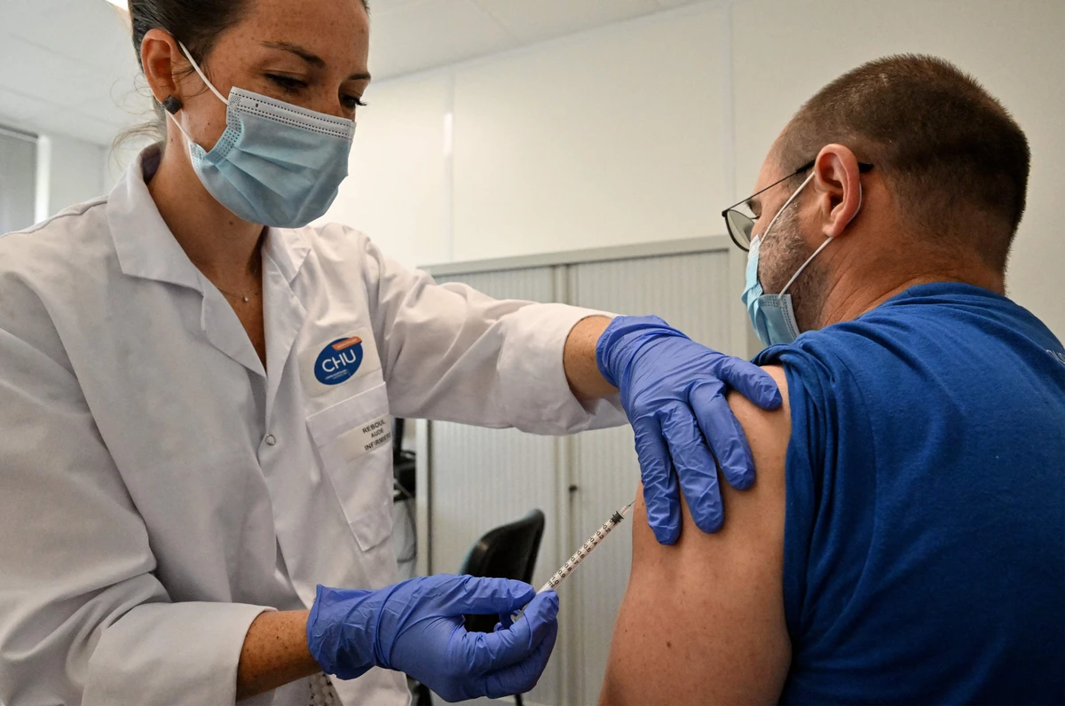A nurse vaccinates a patient against monkeypox at a medical center in Montpellier, southern France on August 23, 2022. (AFP/File)