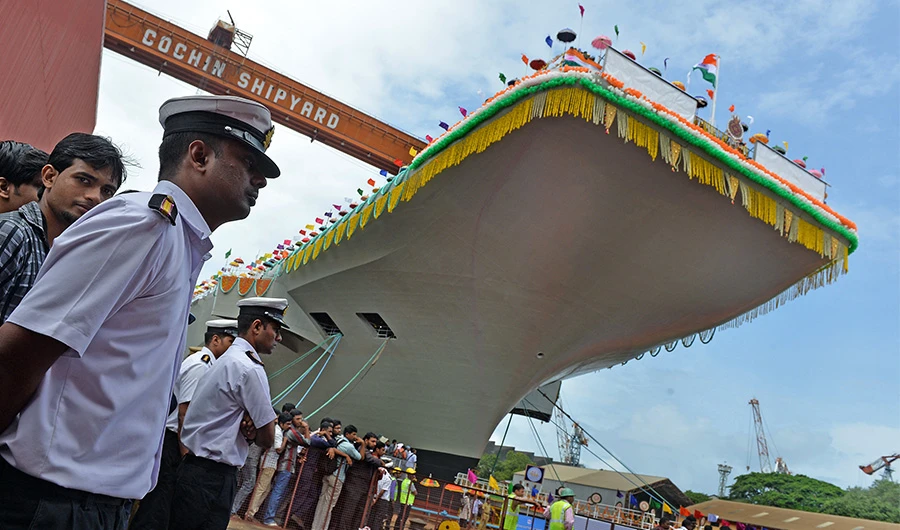 Indian naval officers stand guard during the launch of the indigenously-built aircraft carrier INS Vikrant at the Cochin Shipyard in Kochi on August 12, 2013. (AFP/FILE)