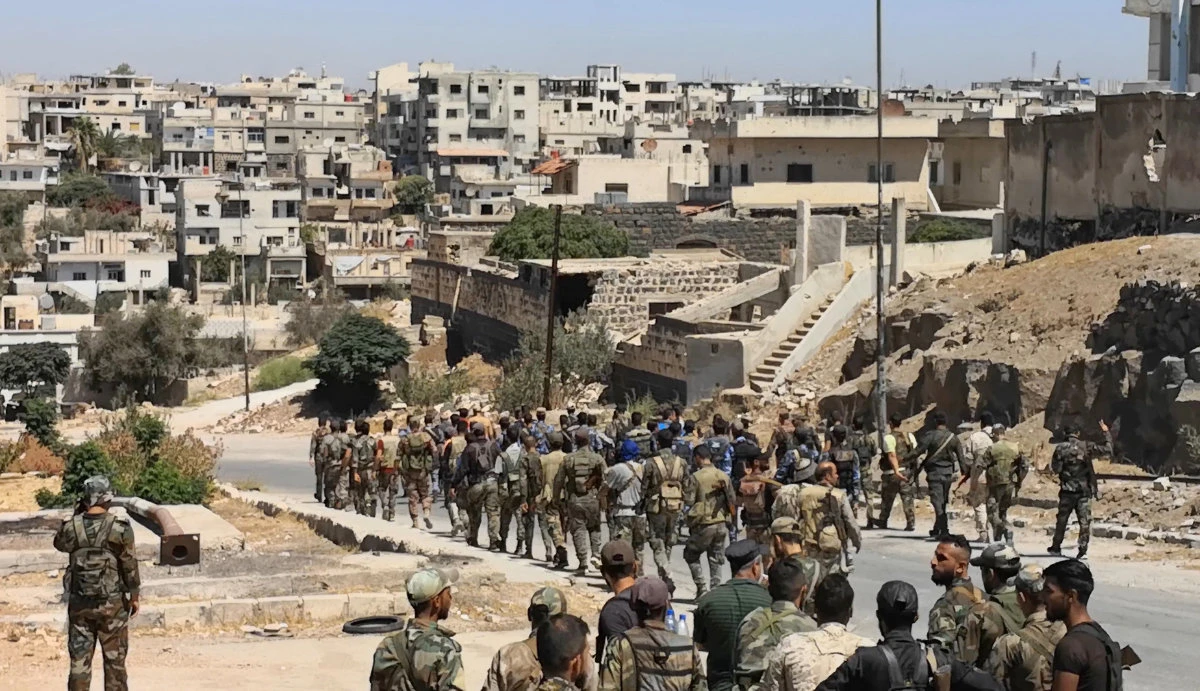 Syrian soldiers enter Daraa city under a ceasefire deal brokered by Russia last year. (SANA handout via AFP/file)