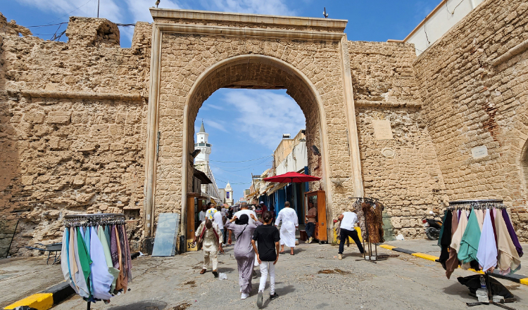 People shop at a market in Libya's capital Tripoli. (AFP)