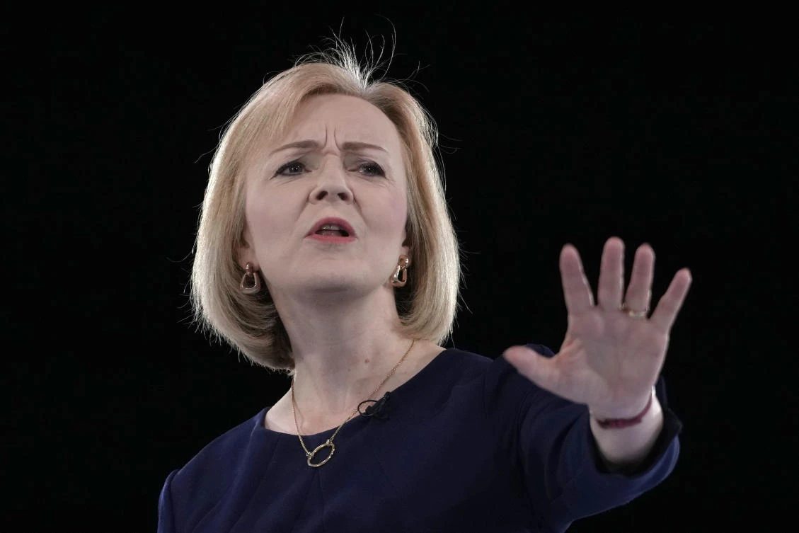 Liz Truss, seen addressing Conservative Party members during a leadership election hustings at Wembley Arena in London, is likely to be named as successor to Boris Johnson on Monday. (AP)